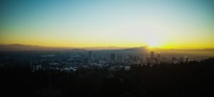 Sun rising over Portland from Washington Park